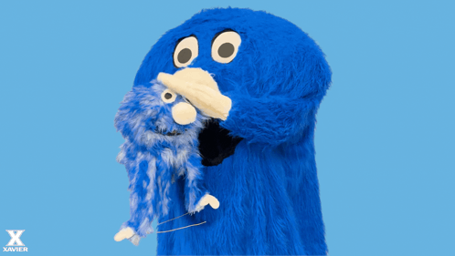Blue Monster Holding Stuffed Animal Saying There There