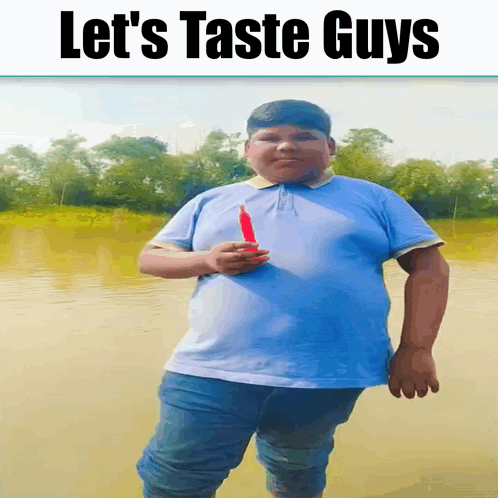 Blue Shirt Boy Holding Red Object Let's Taste Guys