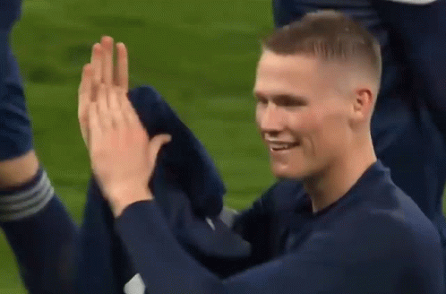 Blue Shirt Man High Fiving Another Man