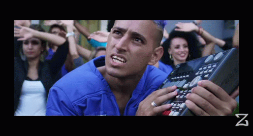 Blue Shirt Man Holding Keyboard with Letter Z
