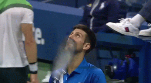 Blue Shirt Man Looking Up at Another Man