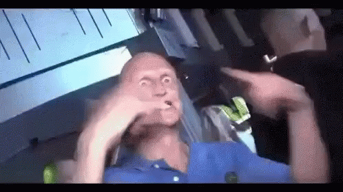 Blue Shirt Man Making Funny Face, Man Points GIF
