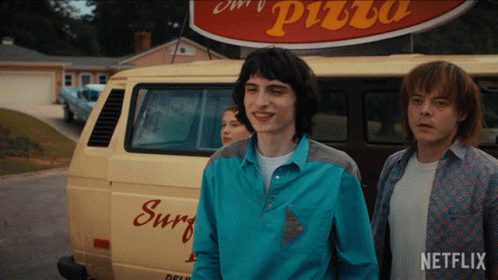 Blue Shirt Man Next to Netflix Shirt Man