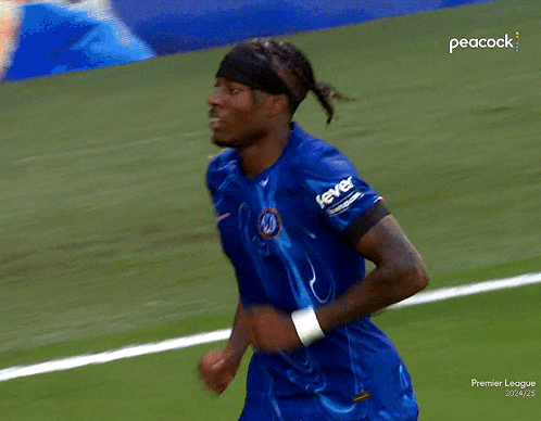Blue Shirt Man Running Soccer Field Peacock