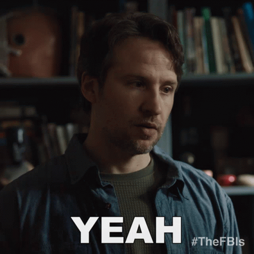Blue Shirt Man Saying Yeah Bookshelf GIF