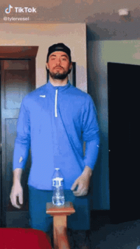 Blue Shirt Man with Gloves and Water Bottle