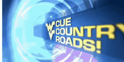 Blue Sign Saying Cue Country Roads