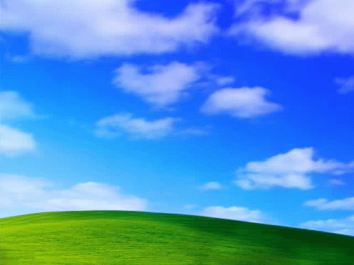Blue Sky With White Clouds Over Green Hill