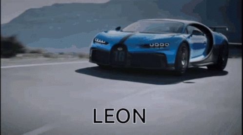 Blue Sports Car Driving Down Road with Leon