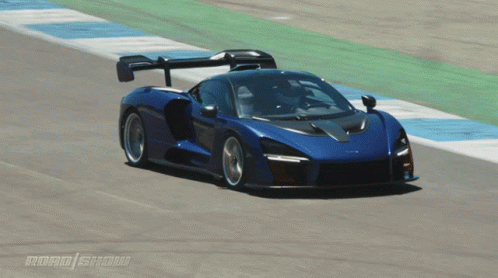 Blue Sports Car Driving on Track