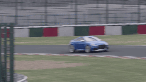 Blue Sports Car on Race Track