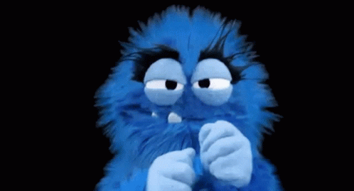 Blue Stuffed Animal Covering Mouth
