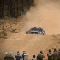 Blue Subaru Driving Dirt Road