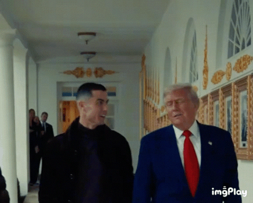 Blue Suit Man Talks to Black Jacket Man