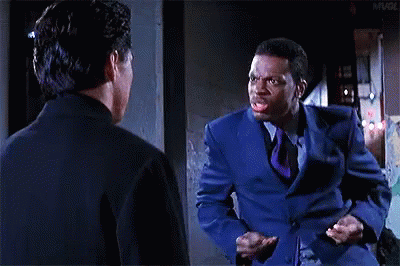 Blue Suit Man With Tie Talking To Black Suit Man GIF
