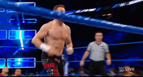 Blue Tank Top Wrestler Fighting Black Tank Top Wrestler GIF