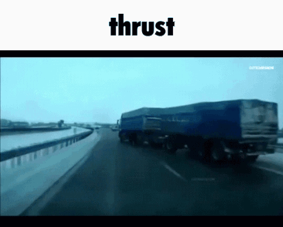 Blue Truck Driving Down Highway with Thrust