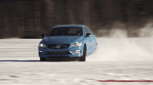 Blue Volvo Car In Snowy Field GIF