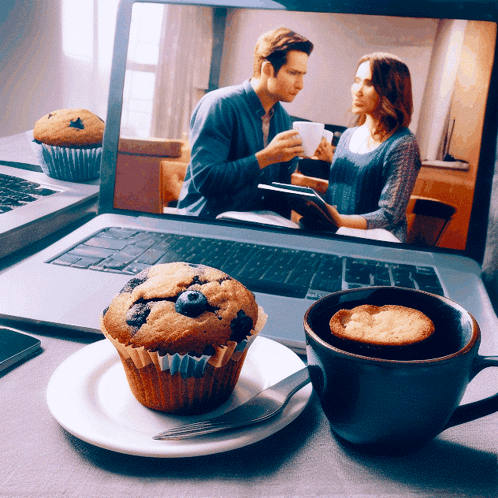 Blueberry Muffin on Plate before Laptop