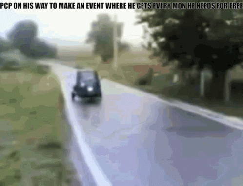 Blurred Car Driving Down Road