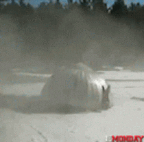 Blurred Car in Snow Saying Monday