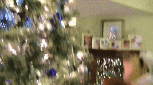 Blurred Christmas Tree With Fireplace GIF