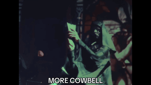 Blurred Man Holding Paper Saying More Cowbell