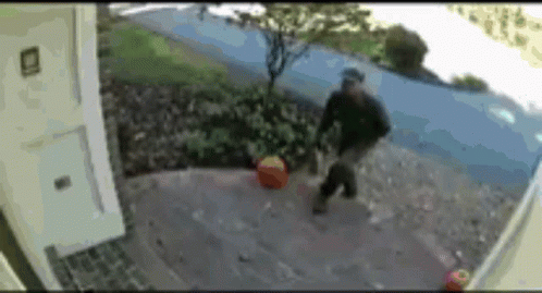 Blurred Man Walking On Sidewalk With Bag GIF