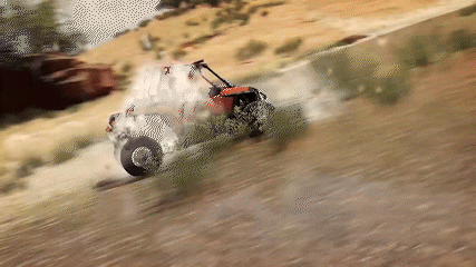 Blurred Person Driving Vehicle on Dirt Road