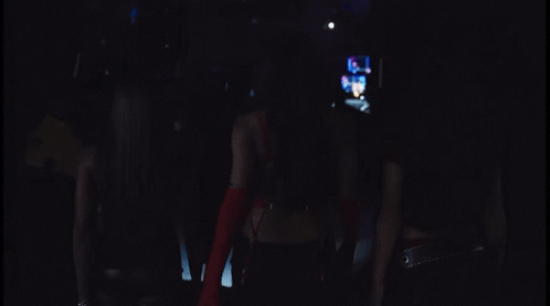 Blurred Person in Dark Room