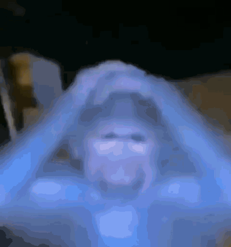 Blurred Person's Face on Blue Background