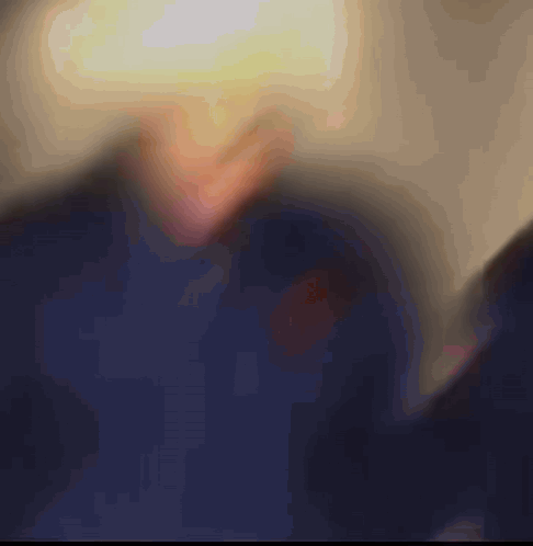 Blurred Person's Face With Yellow Light