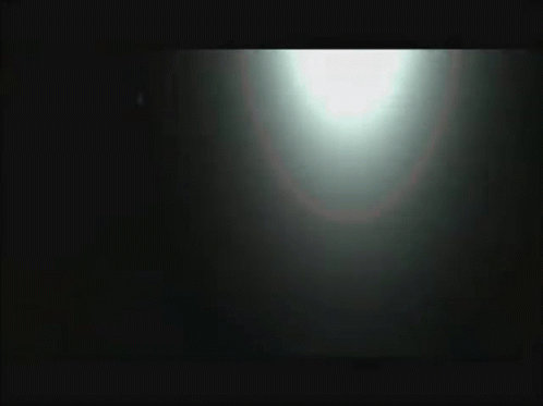 Blurred Person Standing in Front of Car