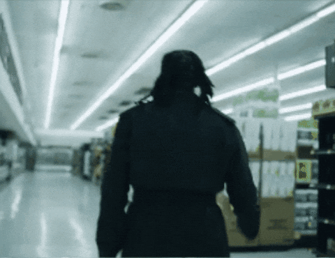 Blurred Person Walking In Store Saying I GIF