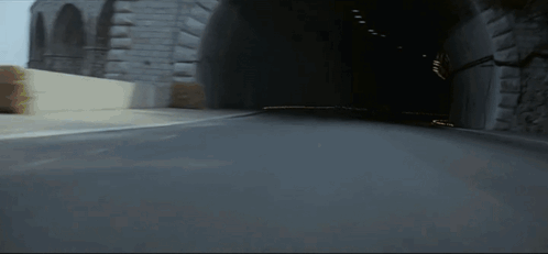 Blurred Race Car Driving Down Street