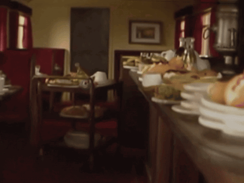 Blurred Restaurant With Plates of Food on Counter