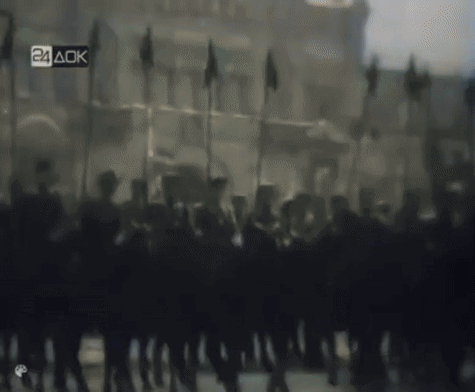 Blurred Soldiers Marching With 24 AOK Sign GIF