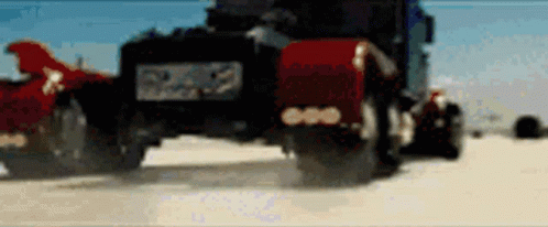 Blurred Truck Driving Down Dirt Road