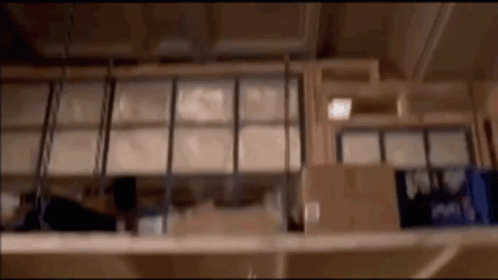 Blurred Warehouse With Shelves of Boxes