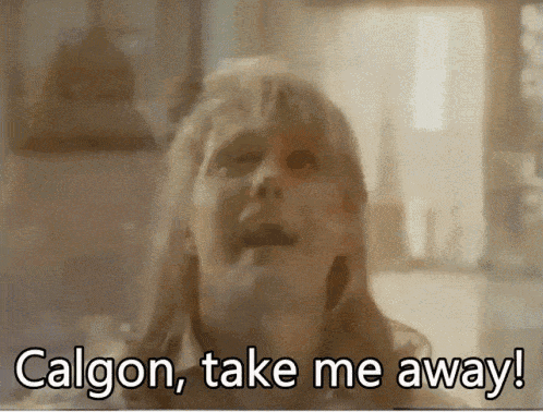 Blurred Woman Saying Calgon Take Me Away GIF