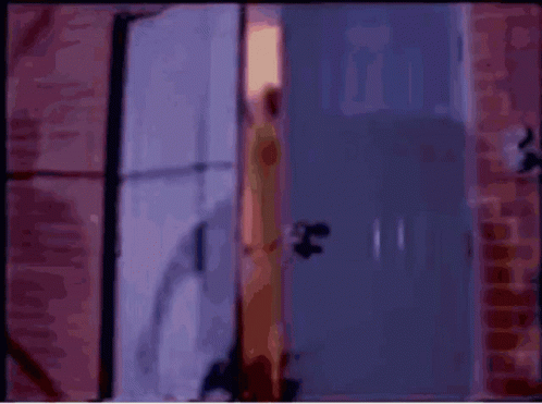 Blurred Woman Standing In Doorway GIF