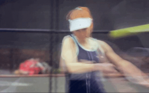 Blurred Woman Wearing White Visor GIF