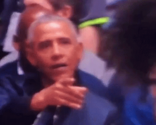 Blurry Barack Obama In Stadium With Folded Hands GIF