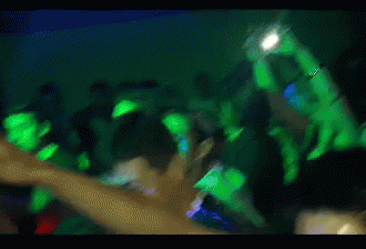 Blurry Crowd Holding Up Hands