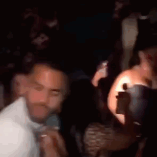 Blurry Group of People Dancing in Club