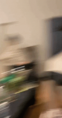 Blurry Hand Holding Bottle