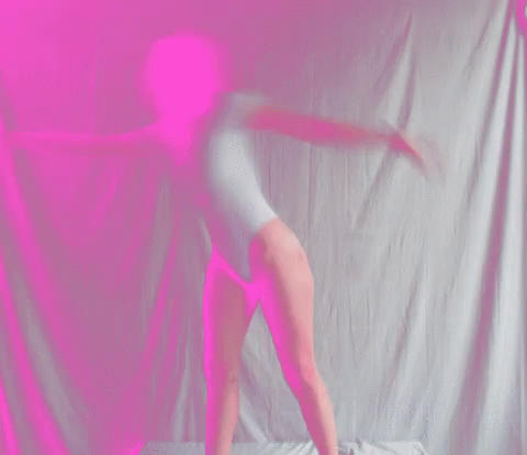 Blurry Image of Person Doing Yoga Pose With Blue Background