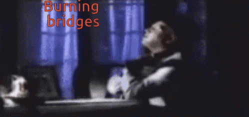 Blurry Man Burning Bridges Red