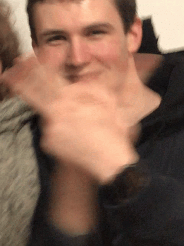 Blurry Man Covering Mouth GIF