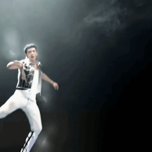 Blurry Man In Black And White Shirt And White Pants GIF